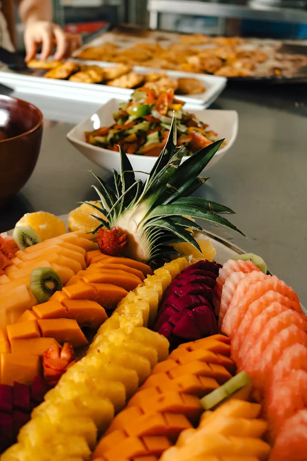 Prepared meal and vegetables arranged on a patterned tablecloth